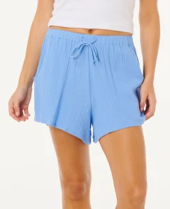 Short Premium Surf Holiday Rip Curl da donna cornflower blue con vita elasticizzata, davanti piatto e linea estiva leggera.