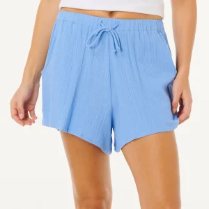 Short Premium Surf Holiday Rip Curl da donna cornflower blue con vita elasticizzata, davanti piatto e linea estiva leggera.